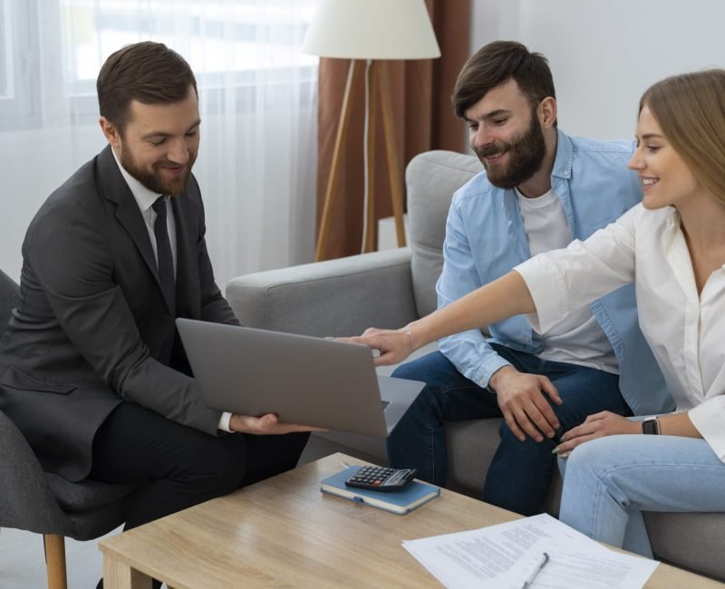 male-real-estate-agent-doing-business-showing-house-potential-buying-couple
